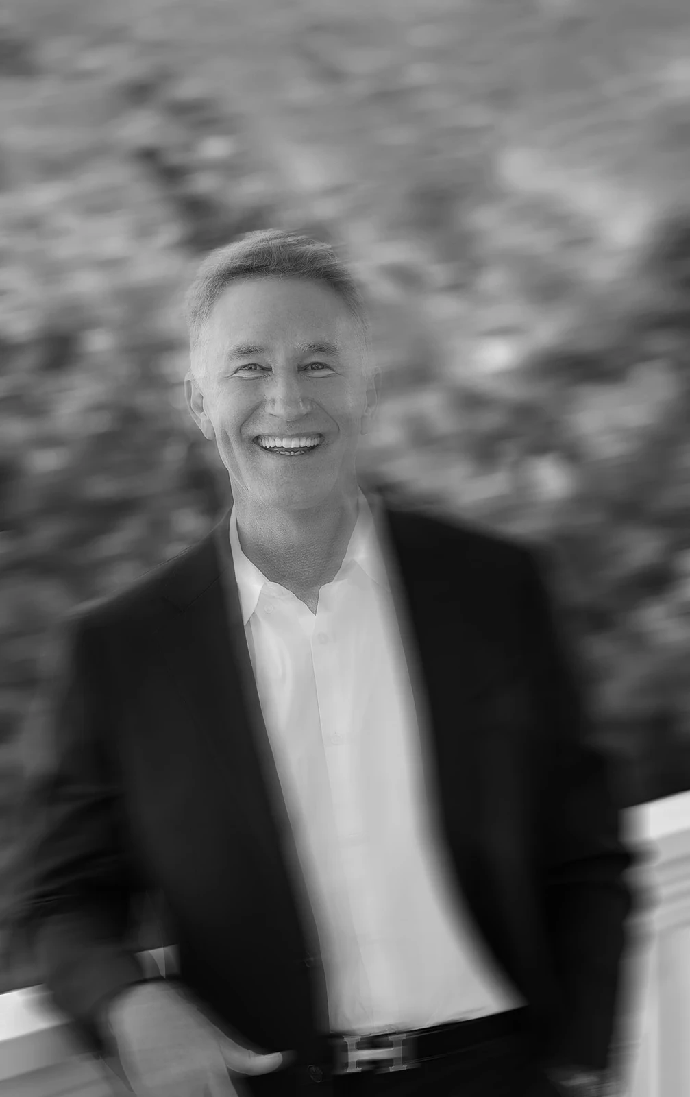 Stephen McGhee in a black-and-white outdoor portrait.